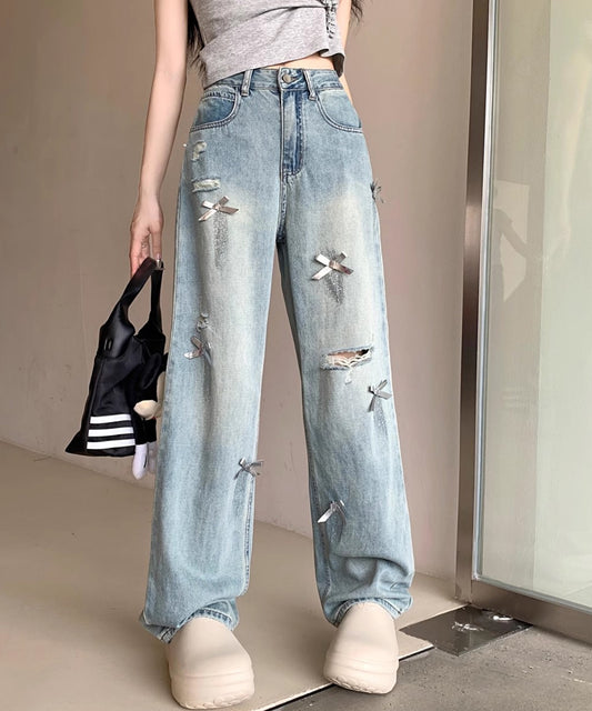 ウォッシュ加工 ダメージ リボン付き ハイウエスト デニムパンツ