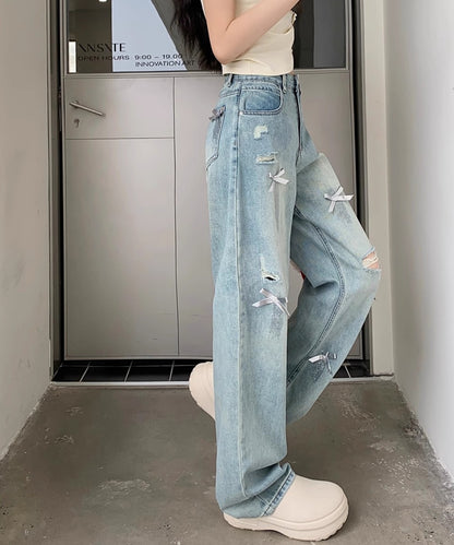 ウォッシュ加工 ダメージ リボン付き ハイウエスト デニムパンツ