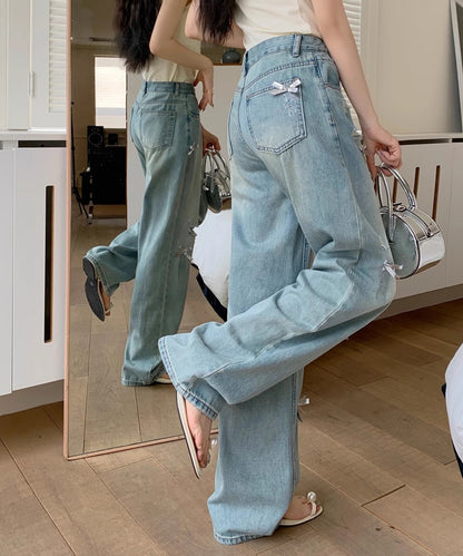 ウォッシュ加工 ダメージ リボン付き ハイウエスト デニムパンツ