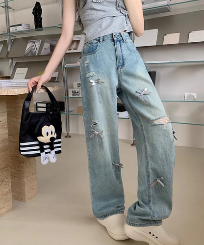 ウォッシュ加工 ダメージ リボン付き ハイウエスト デニムパンツ