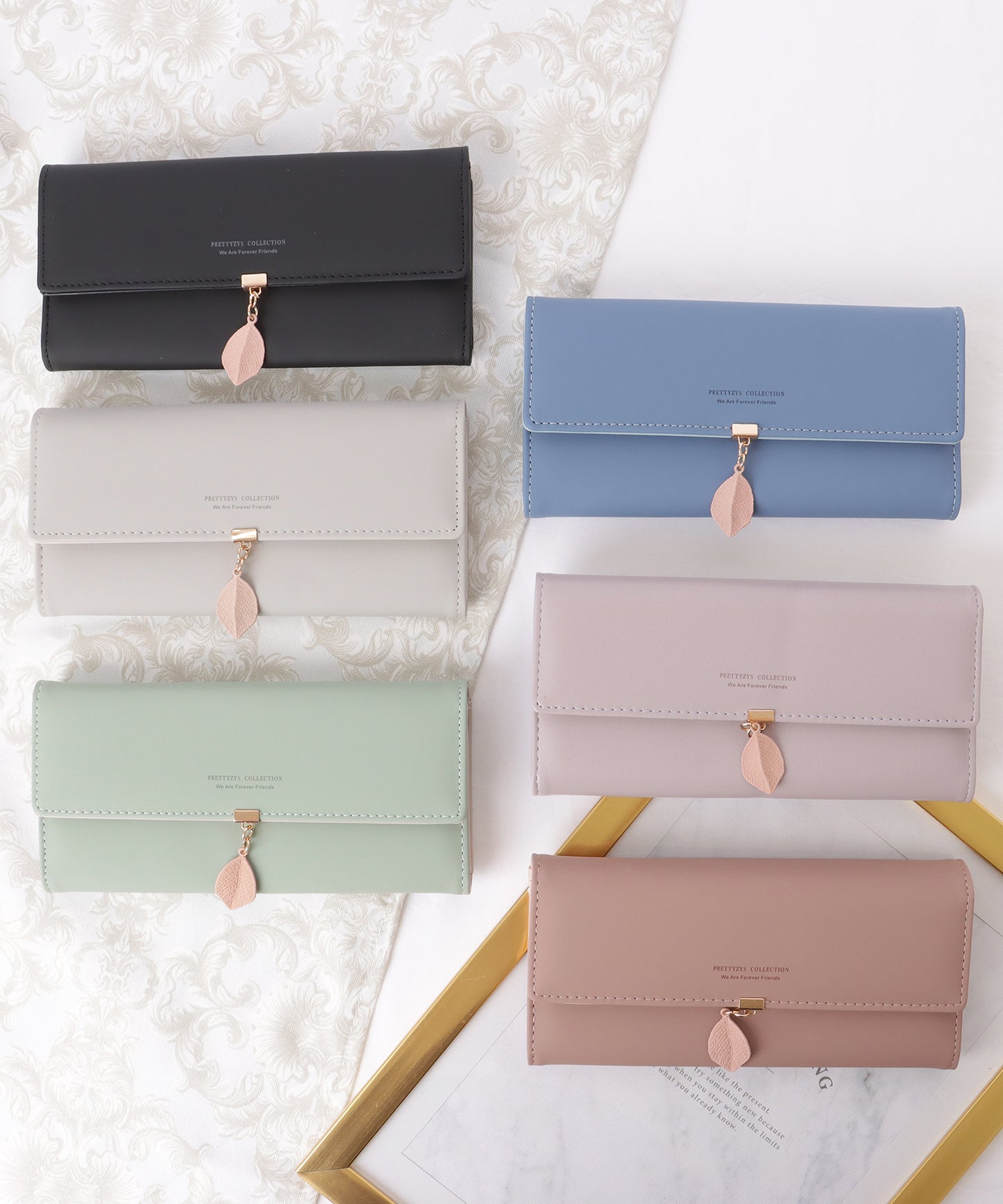 レザー調 リーフ モチーフ付き 三つ折り 長財布